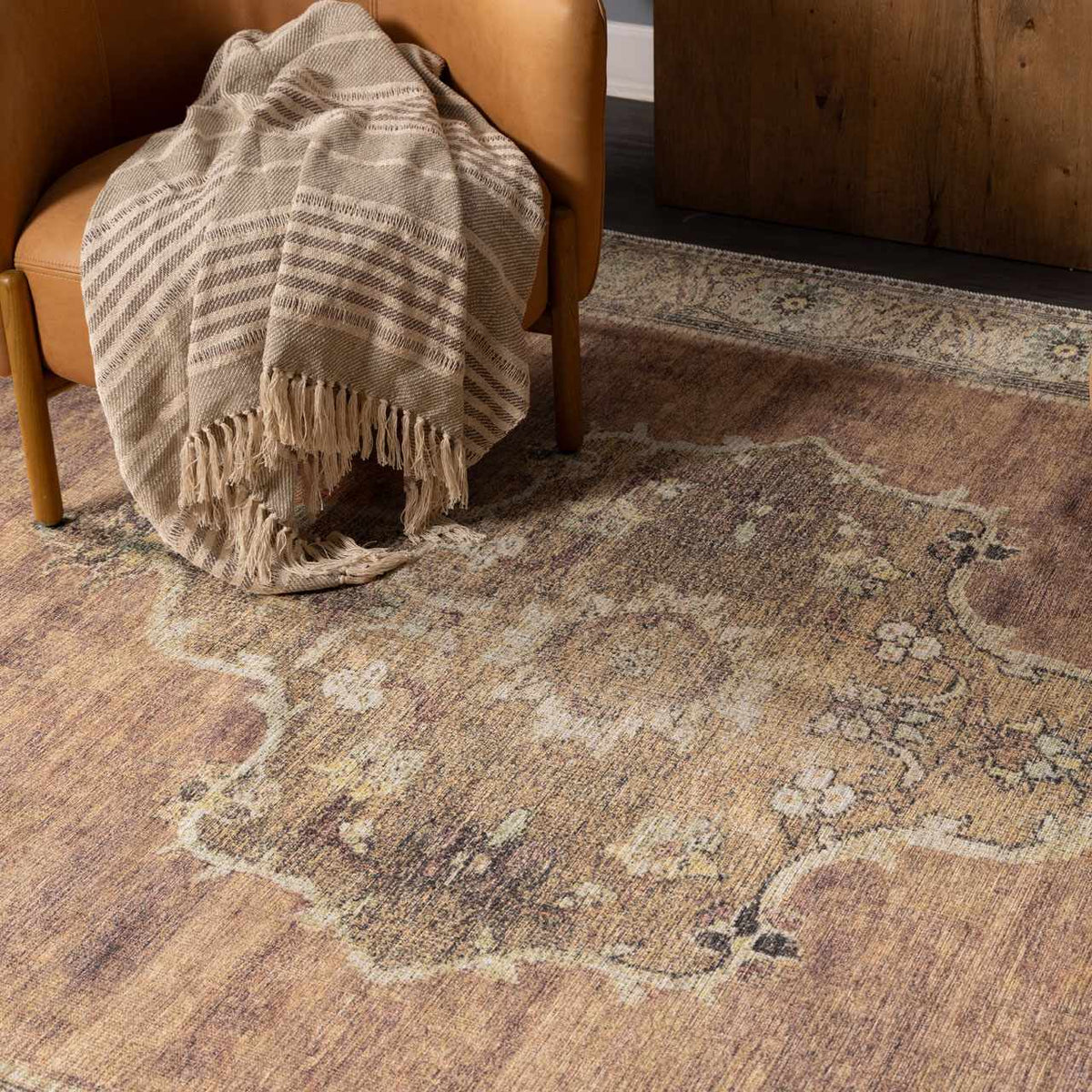 Powhatan washable area rug by Boutique Rugs in warm beige taupe with vintage floral border on Tampa Home & Garden Store