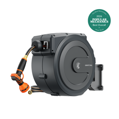Retractable Garden Hose Reel with Auto Rewind by Giraffe Tools; gray unit with orange hose on Tampa Home & Garden Store