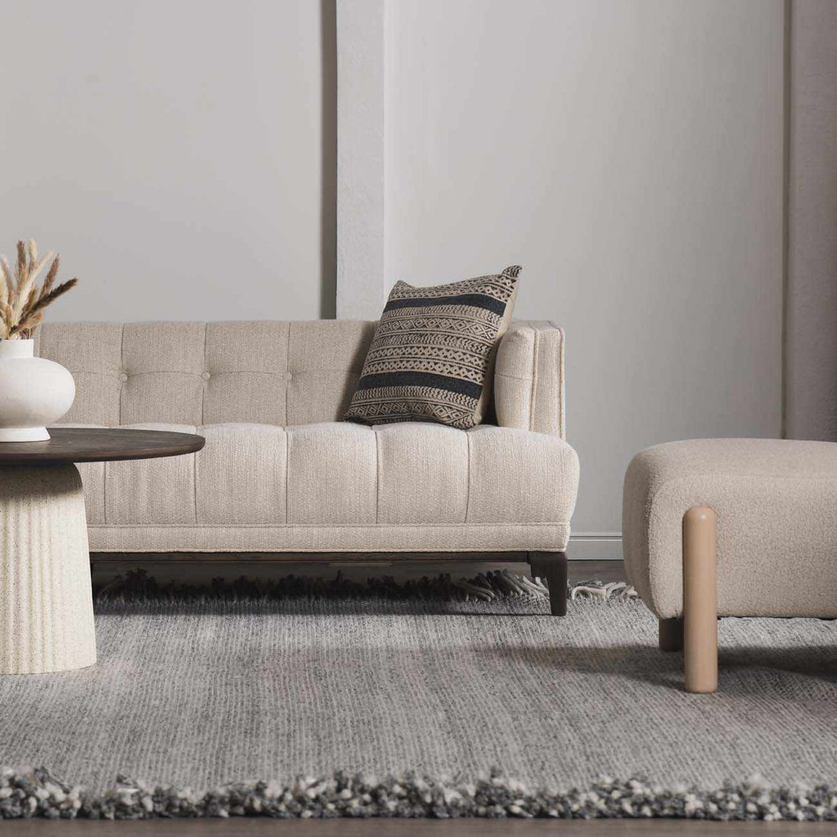 Stenhousemuir Luxe Handmade Rug beige textured weave with fringe in a neutral living room on Tampa Home & Garden Store