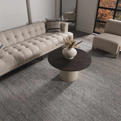 Stenhousemuir Luxe Handmade Rug beige woven area rug in a modern living room by Boutique Rugs on Tampa Home & Garden Store