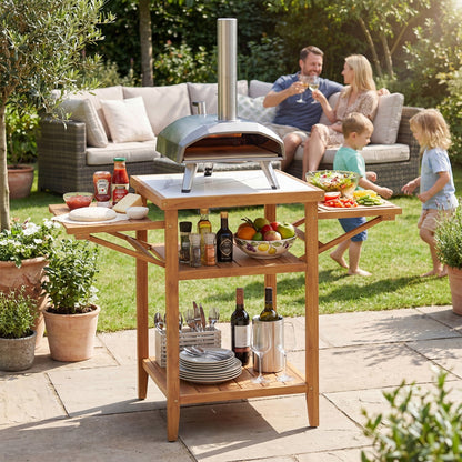 GemGear acacia outdoor grill table with faux marble top and drop-leaf panels in a backyard on Tampa Home & Garden Store