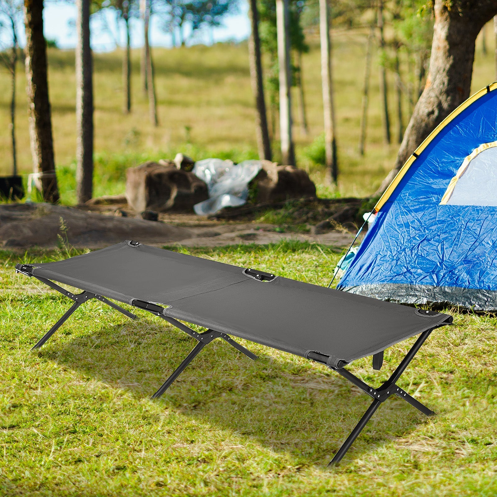 Adults Kids Folding Camping Cot gray fabric with metal frame at campsite beside blue tent on Tampa Home & Garden Store