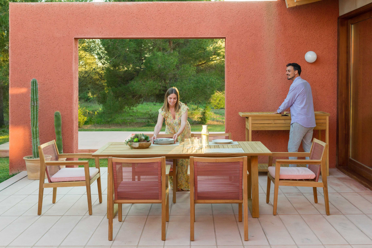 Agate rectangular teak outdoor dining table with four teak chairs on a patio LifestyleGarden US on Tampa Home & Garden Store