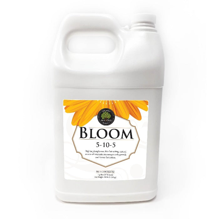 Bloom 5-10-5 fertilizer by Rivendell Distribution, white plastic jug with orange flower label on Tampa Home & Garden Store