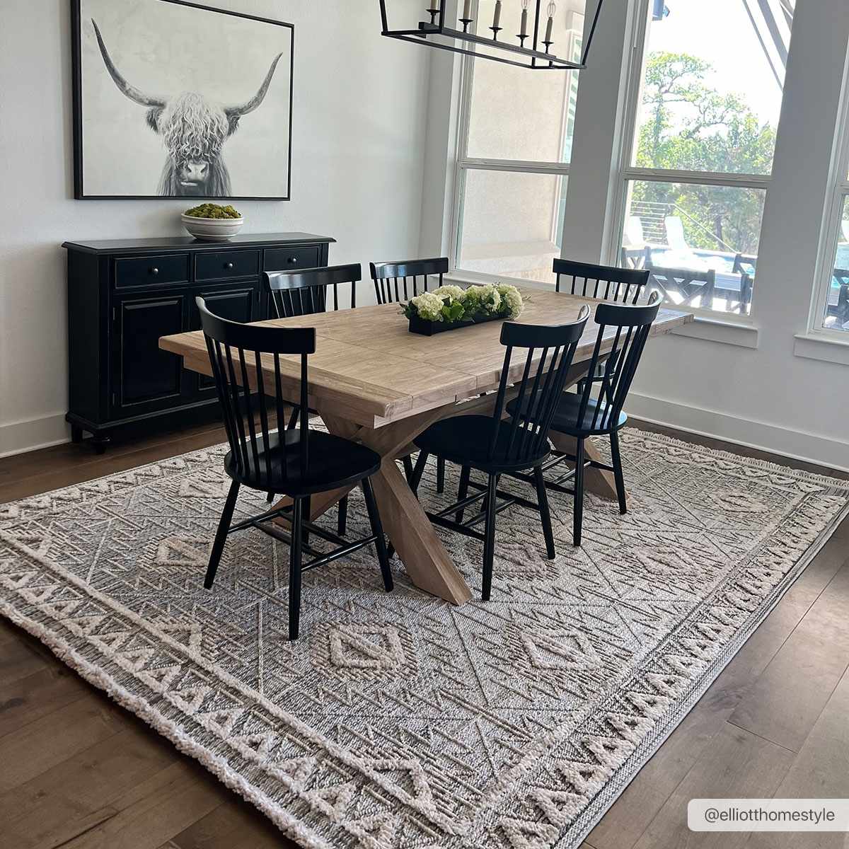 Agoo High-Low Pile Rustic Rug with geometric pattern under a dining table and black chairs on Tampa Home & Garden Store