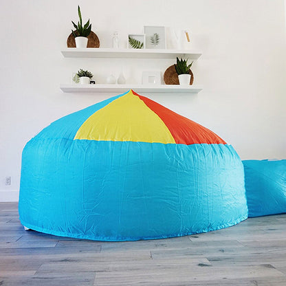 AirFort Beach Ball blue inflatable kids play fort with yellow red panels in living room on Tampa Home & Garden Store