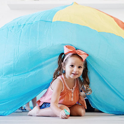 AirFort Beach Ball blue inflatable kids play fort with yellow cap, a smiling child inside on Tampa Home & Garden Store