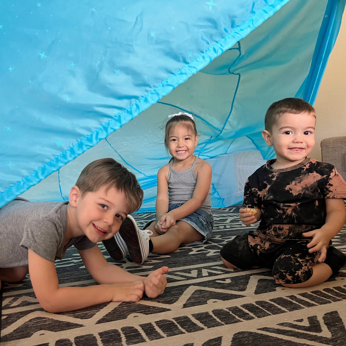 AirFort Constellation Glow-in-the-Dark Inflatable Play Fort blue starry interior, kids inside on Tampa Home & Garden Store