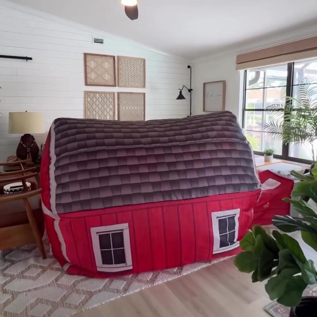 AirFort Farmers Barn inflatable play fort, red barn exterior with grey quilted roof on Tampa Home & Garden Store