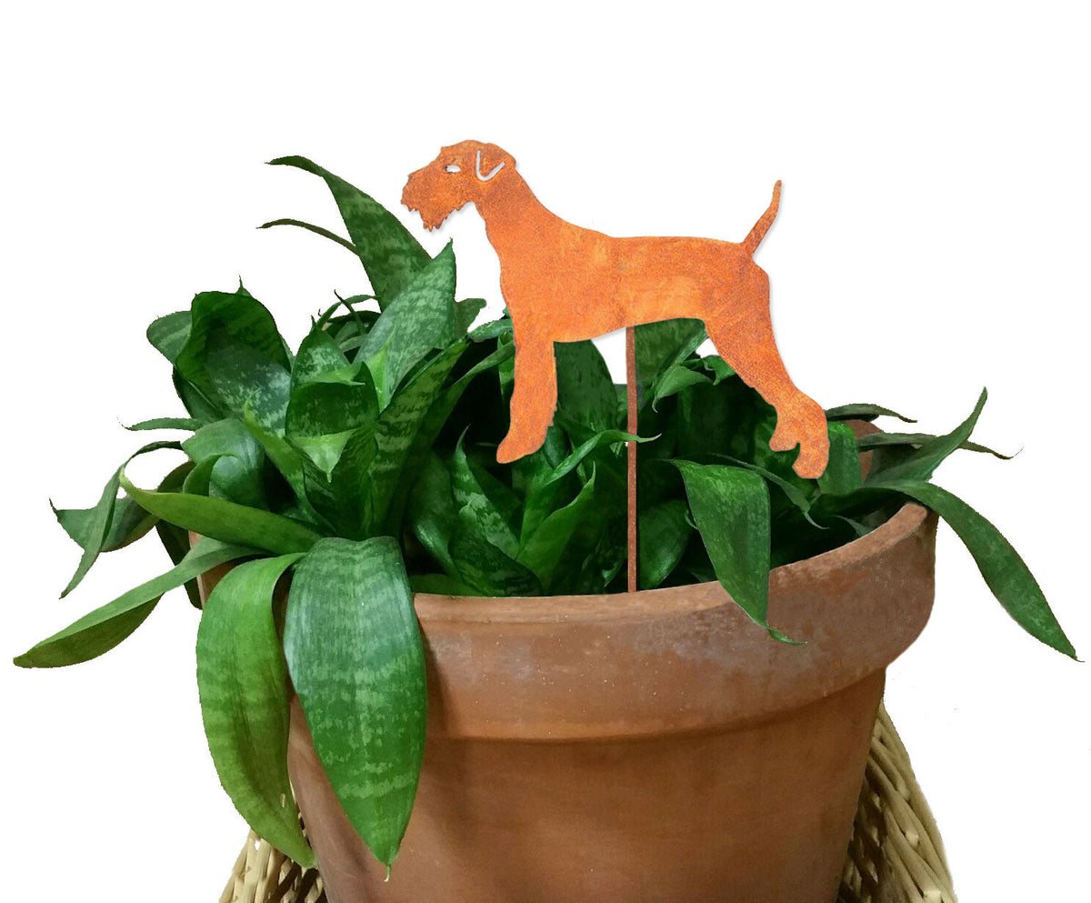 Airedale Terrier plant stake, rust-orange metal silhouette in a terracotta planter on Tampa Home & Garden Store