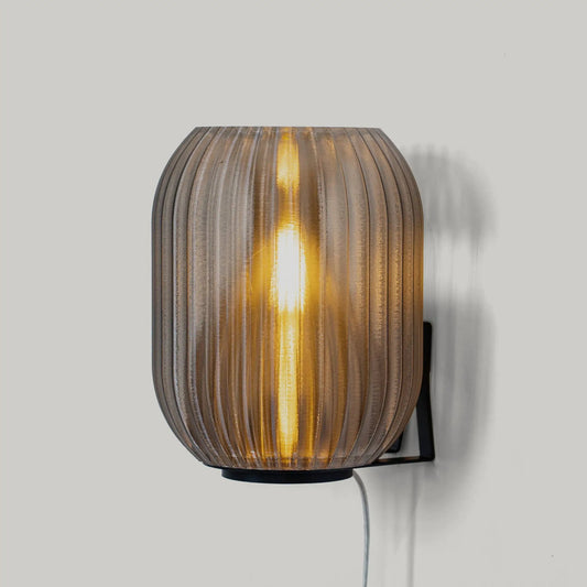 Allium Sconce by Wooj Design, warm amber ribbed metal wall light on Tampa Home & Garden Store
