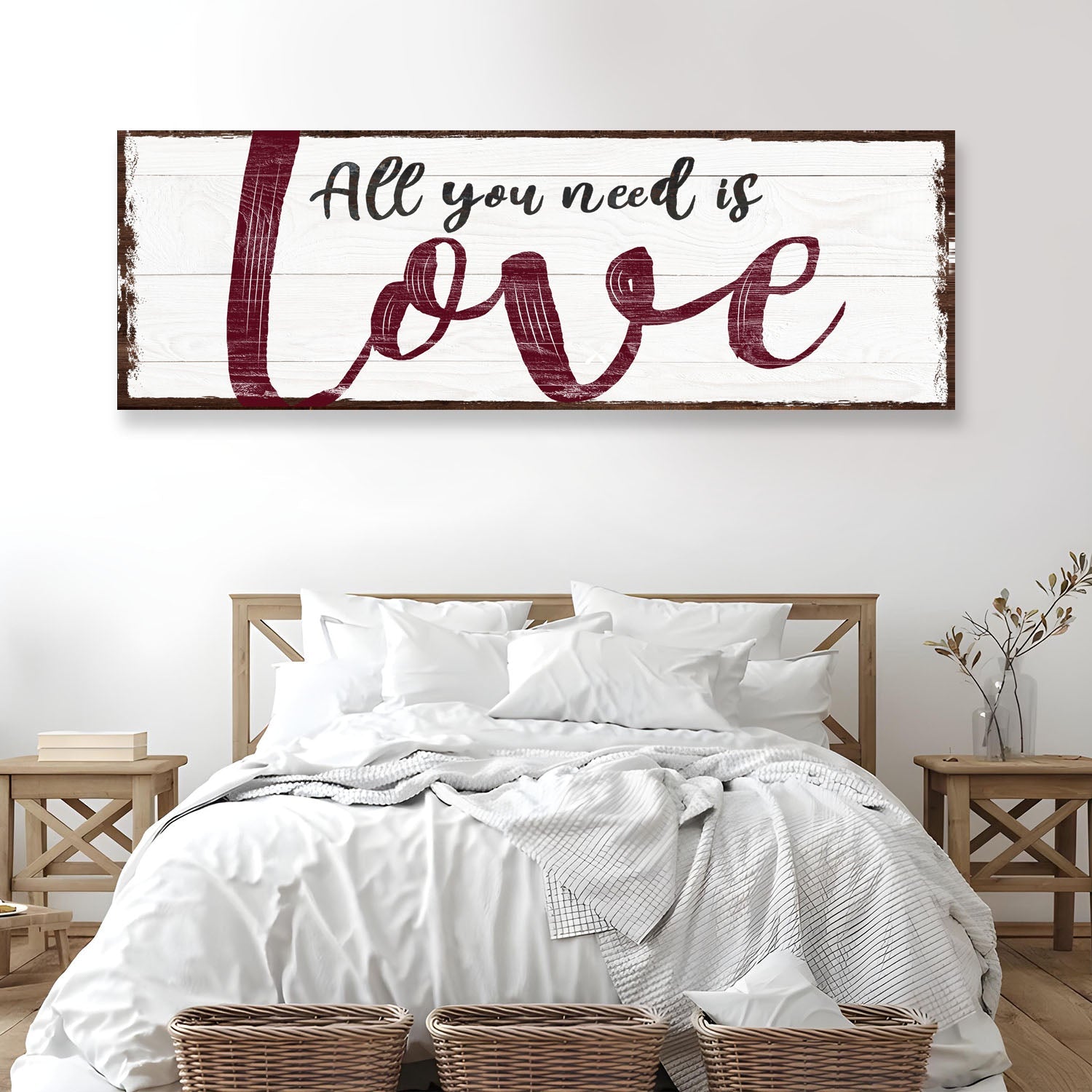 All You Need Is Love canvas sign on rustic whitewashed wood with burgundy script above a bed on Tampa Home & Garden Store