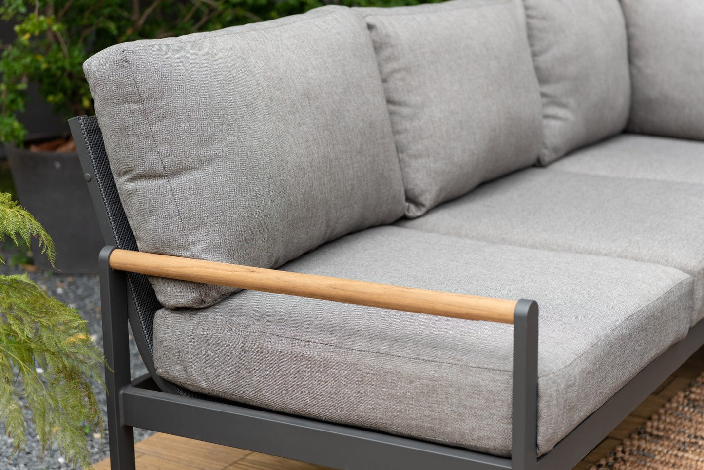 Amber Sectional Coffee Set, gray cushions with wood armrests on dark metal balcony frame on Tampa Home & Garden Store