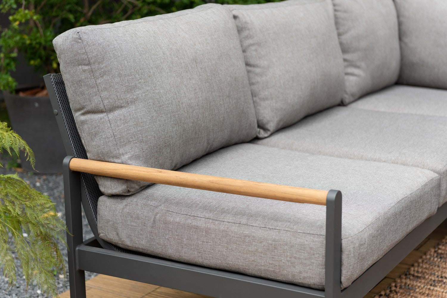 Amber Sectional Coffee Set, gray cushions with wood armrests on dark metal balcony frame on Tampa Home & Garden Store