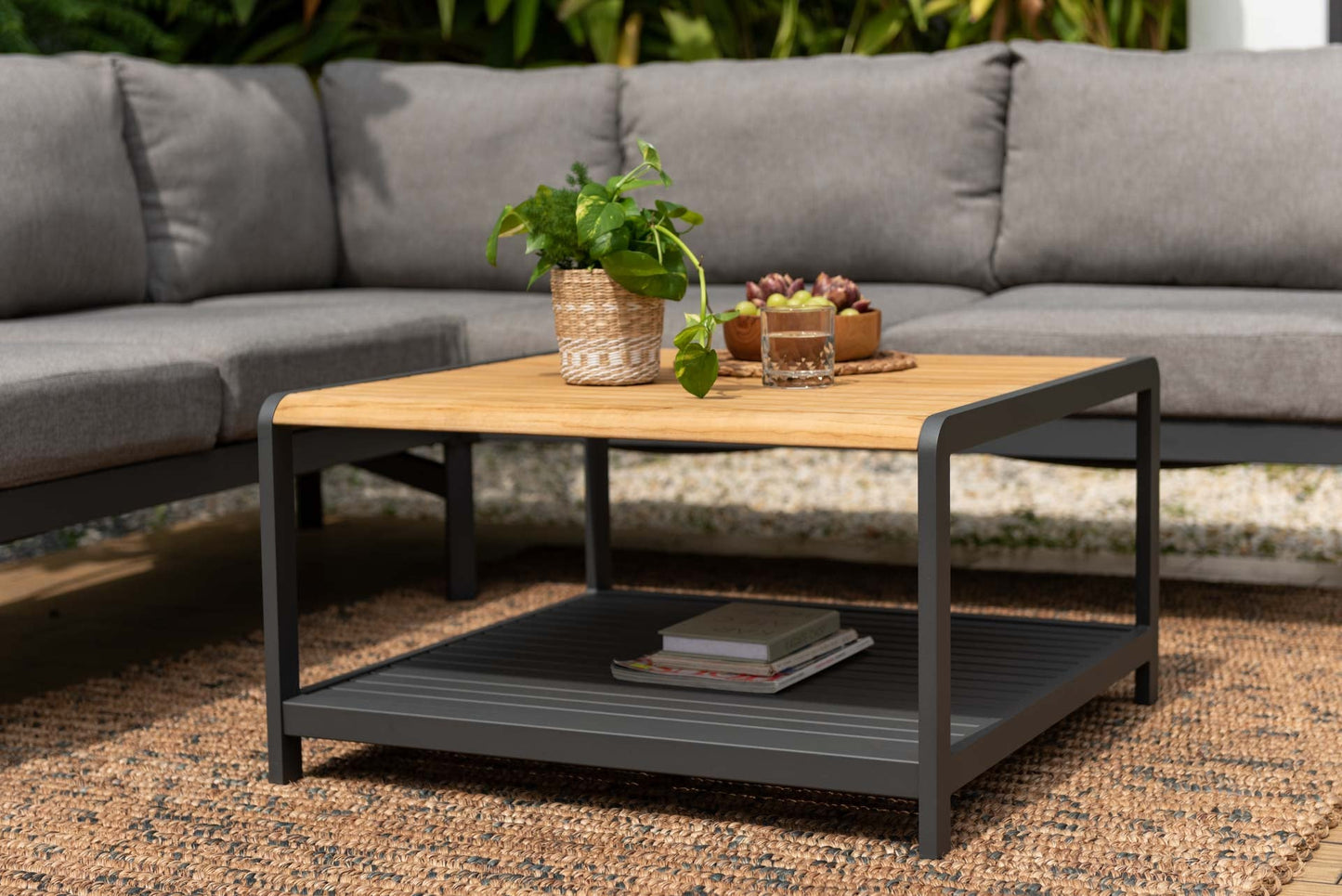 Amber Sectional Coffee Set with wood top table and gray metal frame on a balcony on Tampa Home & Garden Store