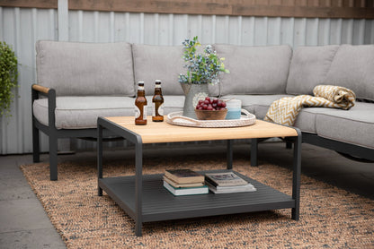 Amber Sectional Coffee Set with gray cushions and wooden-top table on a balcony on Tampa Home & Garden Store