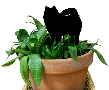 American Eskimo dog plant stake silhouette on a green leafy plant in a terracotta pot on Tampa Home & Garden Store