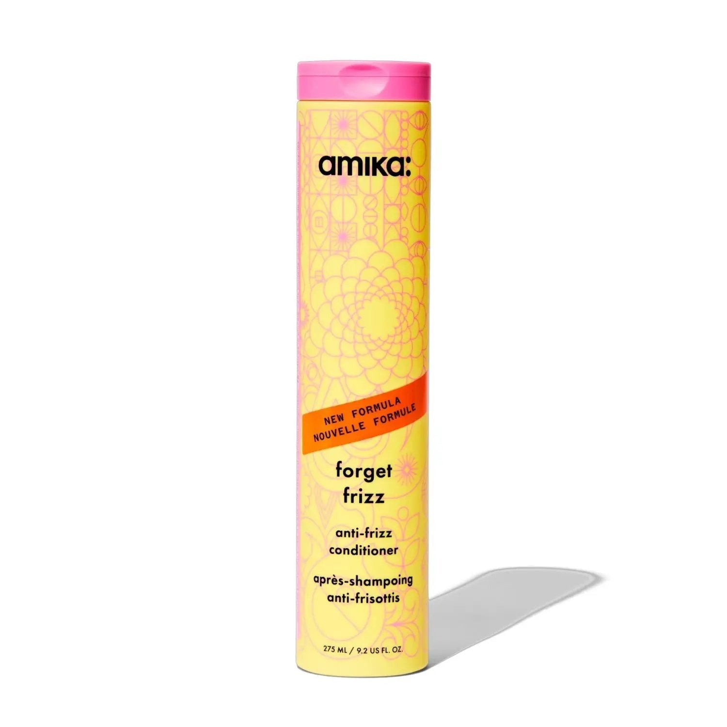 Amika Forget Frizz conditioner bottle, yellow with pink cap on Tampa Home & Garden Store