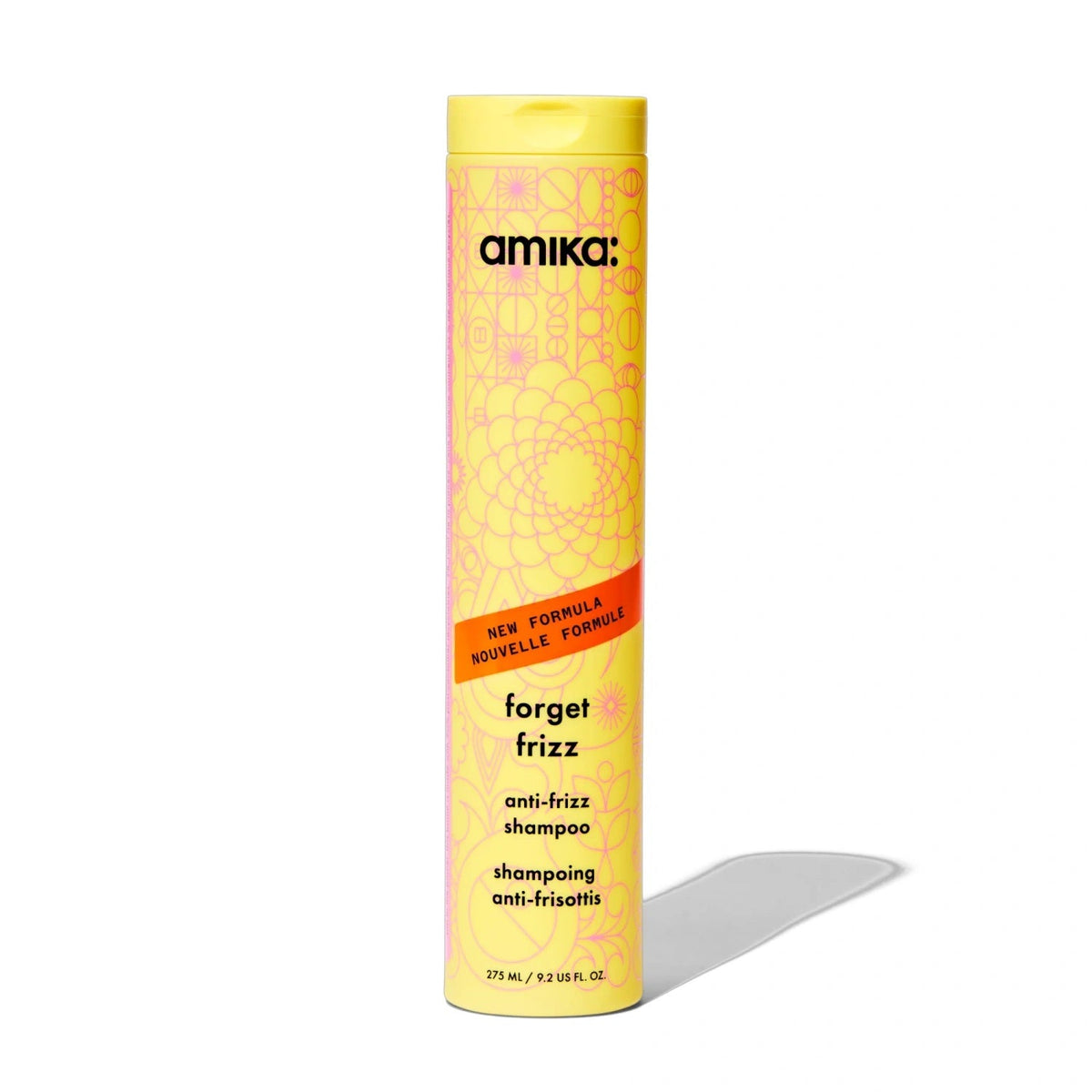 Amika Forget Frizz anti-frizz shampoo bottle, yellow with pink pattern and orange banner on Tampa Home & Garden Store