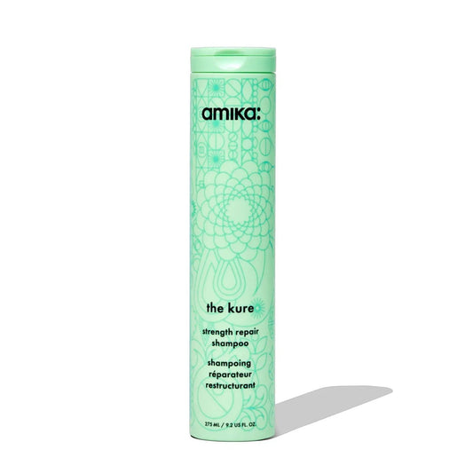Amika The Kure Bond Repair Shampoo bottle in mint green with floral motif Nava Beauty packaging on Tampa Home & Garden Store