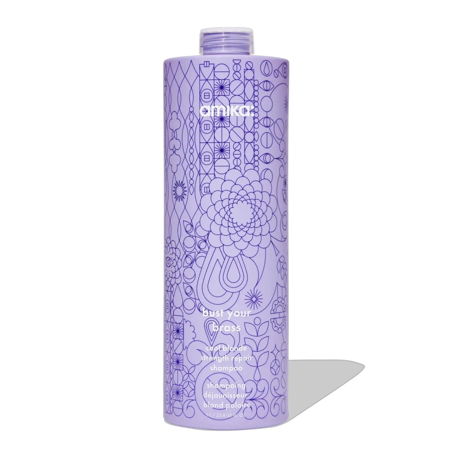 Amika Bust Your Brass Cool Blonde Repair Shampoo bottle, purple with intricate geometric pattern on Tampa Home & Garden Store