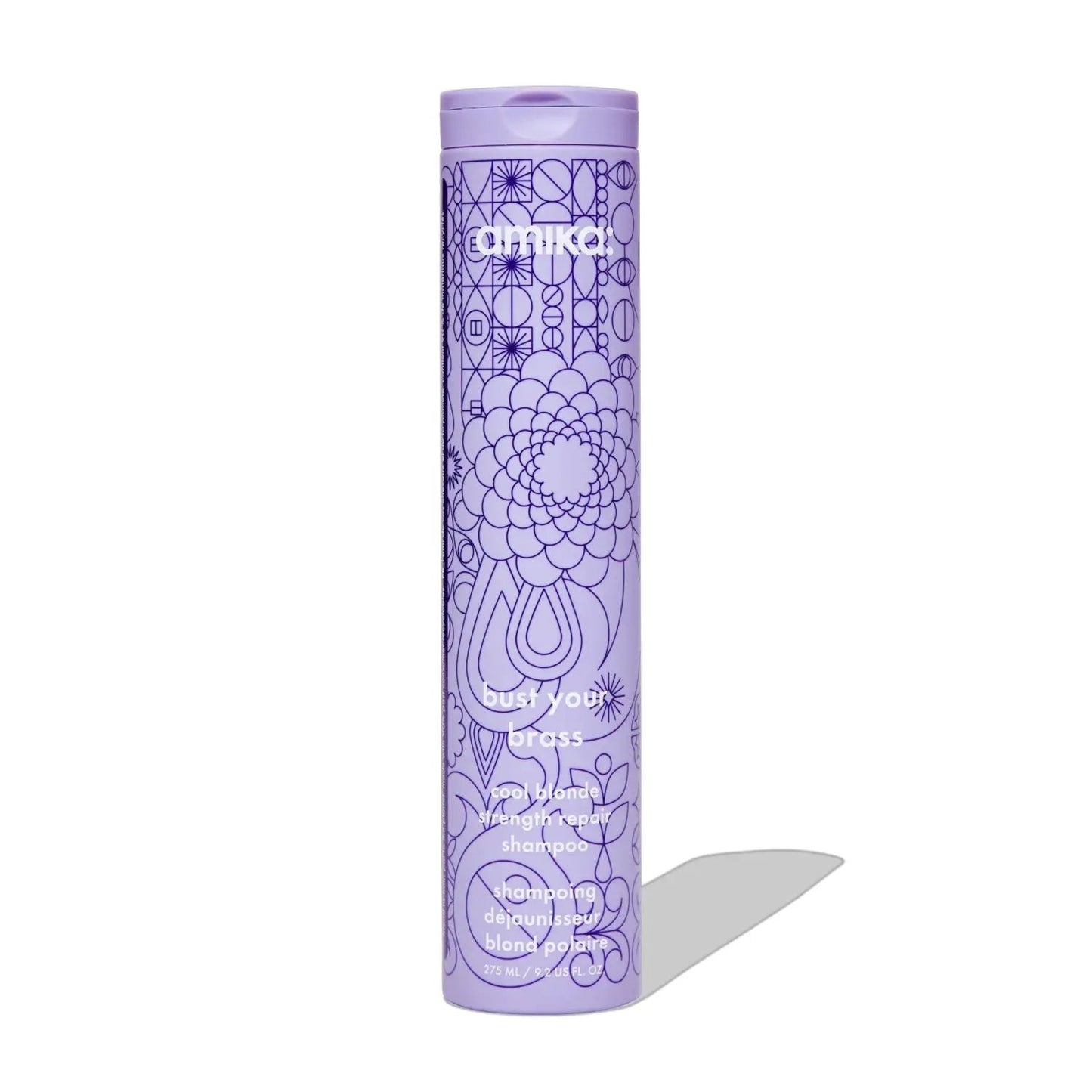 Amika Bust Your Brass Cool Blonde Repair Shampoo bottle, purple with geometric line-art pattern on Tampa Home & Garden Store