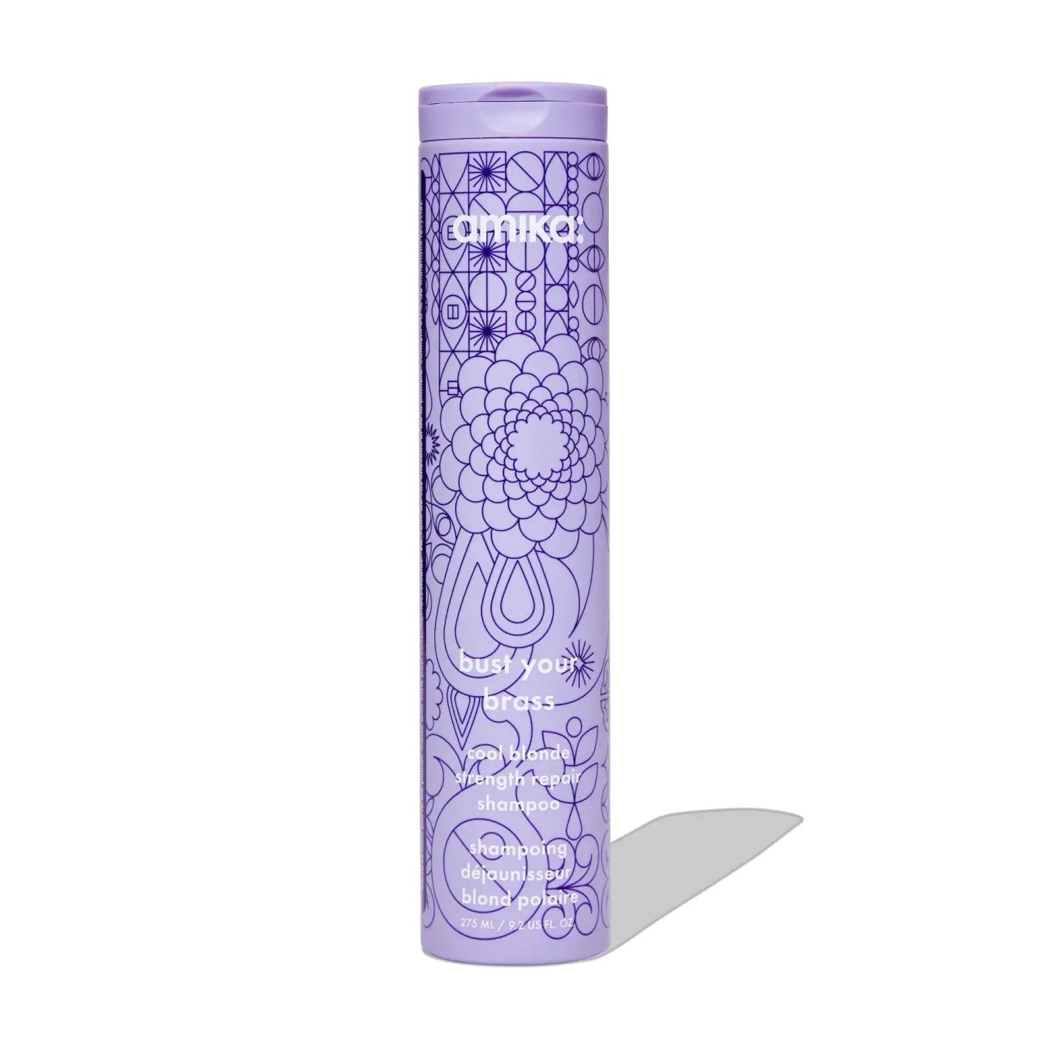 Amika Bust Your Brass Cool Blonde Repair Shampoo bottle, purple with geometric line-art pattern on Tampa Home & Garden Store