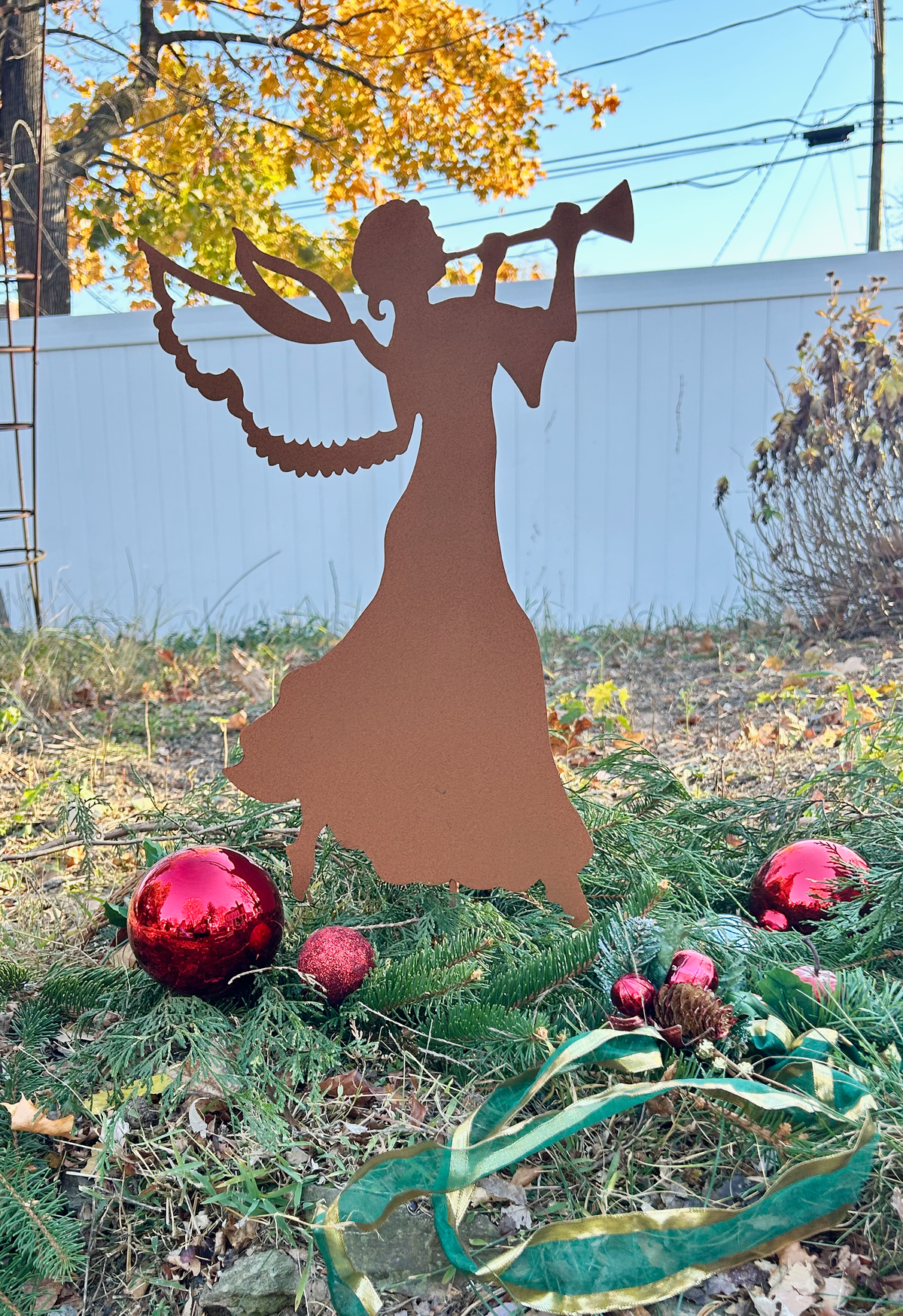 Rust-colored angel garden stake wall art by Rustica Ornamentals for Christmas on Tampa Home & Garden Store