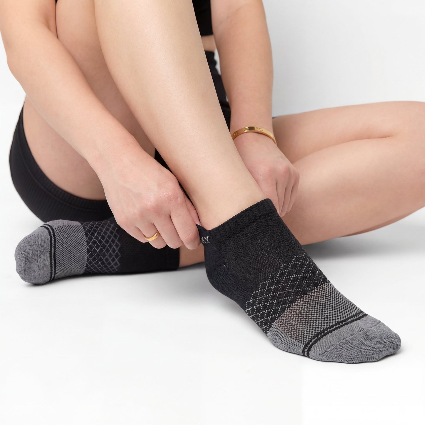 DeadSoxy Essentials Ankle Socks in black with gray patterned cuffs worn by a model on Tampa Home & Garden Store