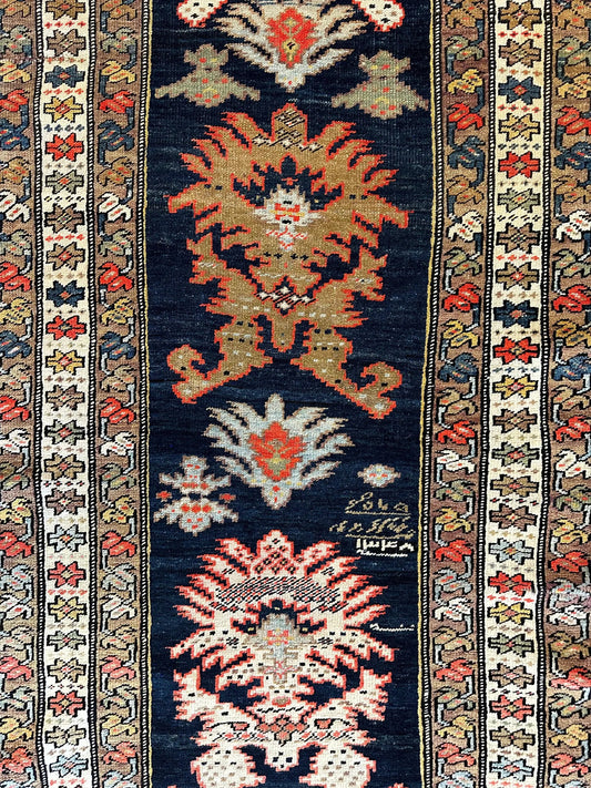 Antique Caucasian Karabakh Rug hand-knotted by Rugistan, navy field with red-gold medallions on Tampa Home & Garden Store