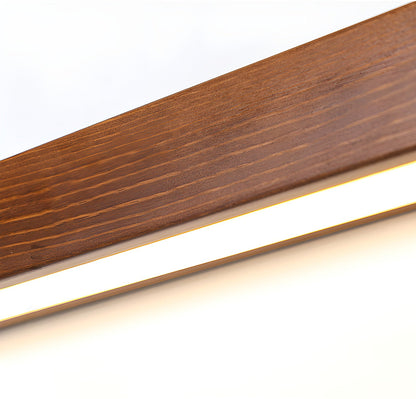 Pinea linear pine wood wall light with frosted diffuser; warm LED glow on Tampa Home & Garden Store