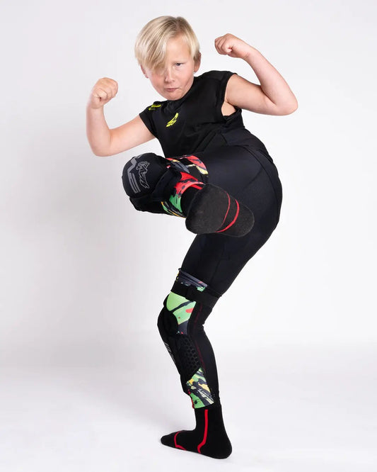Youth knee guard EVS Sports Slayco96 Explosion in black with colorful panel accents on Tampa Home & Garden Store