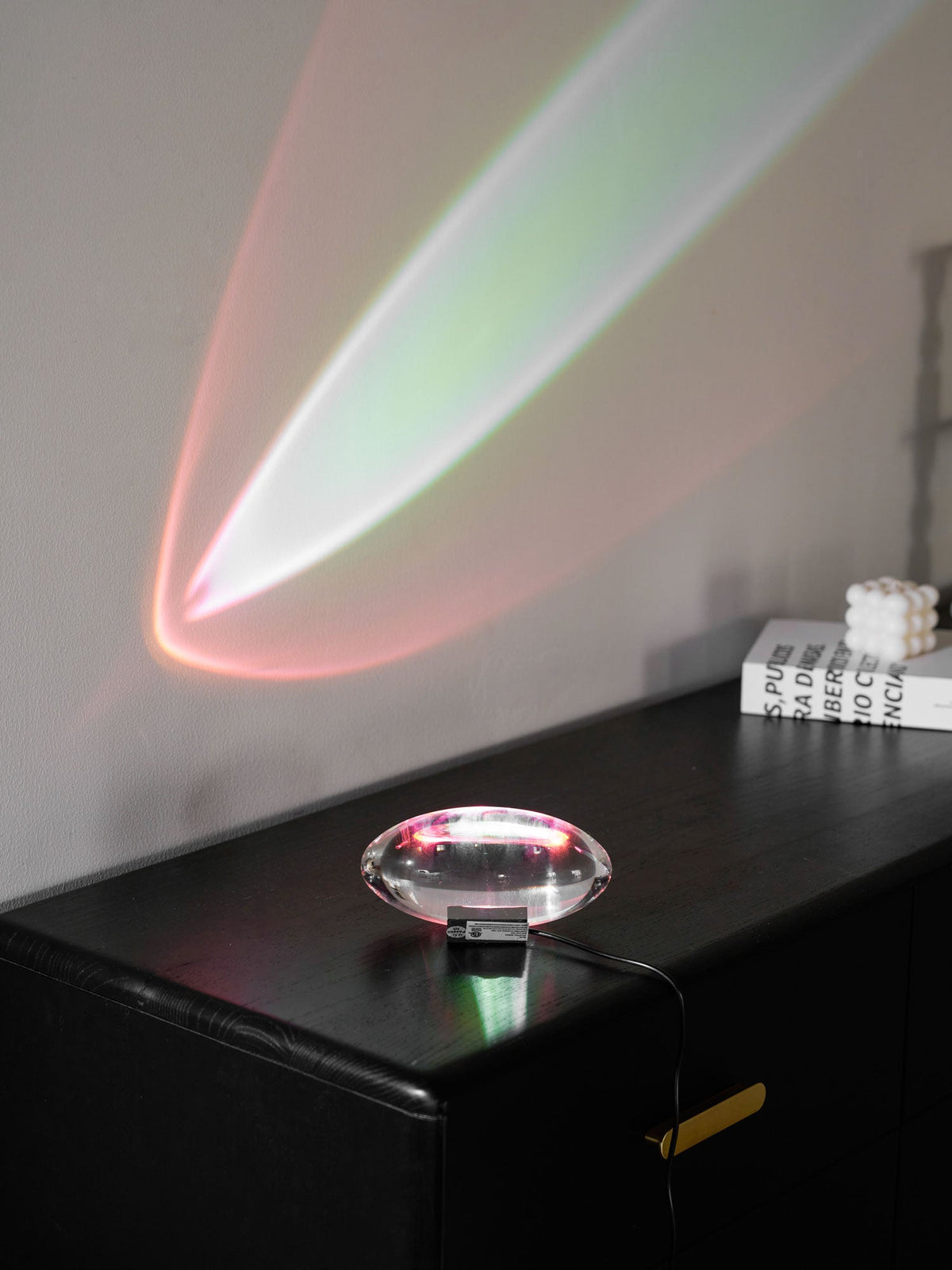 Seren glass table lamp with chrome base creating rainbow glow on desk on Tampa Home & Garden Store