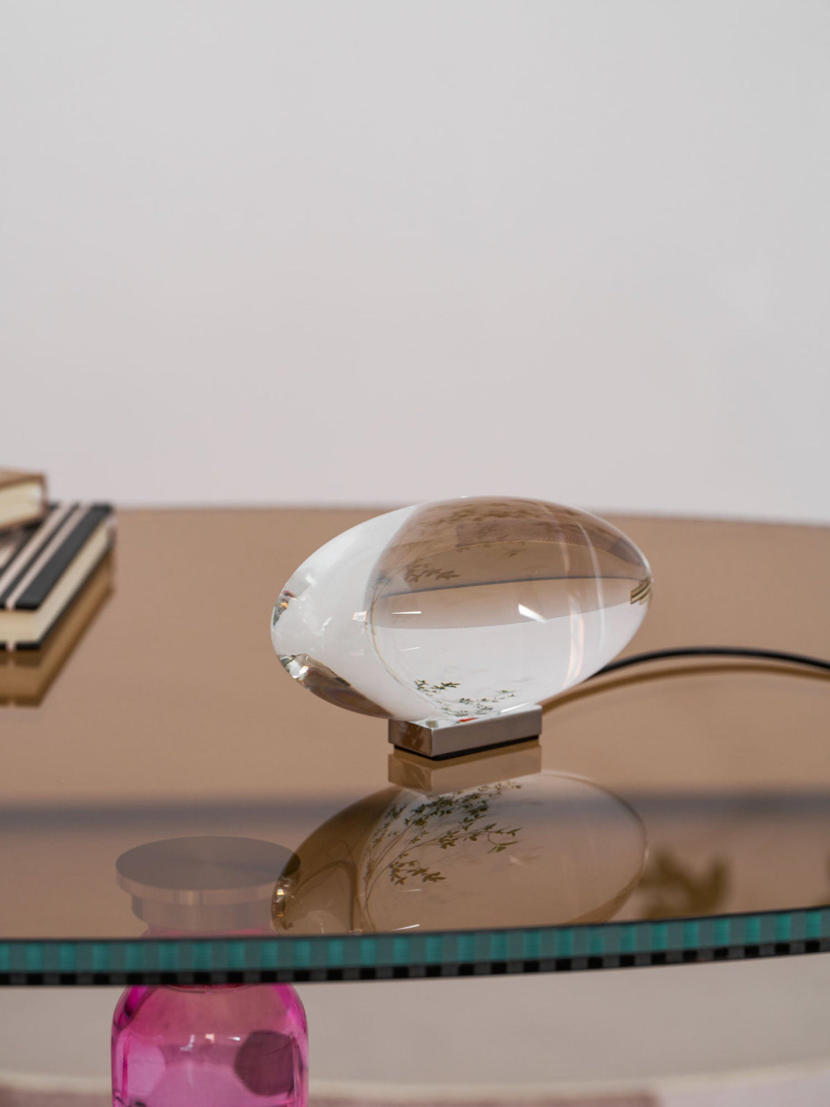 Seren crystal glass table lamp with chrome base on a reflective glass desk on Tampa Home & Garden Store