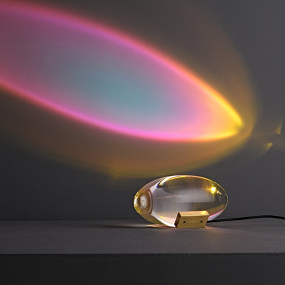 Seren crystal glass table lamp with brass base, plug-in desk light casting rainbow glow on Tampa Home & Garden Store