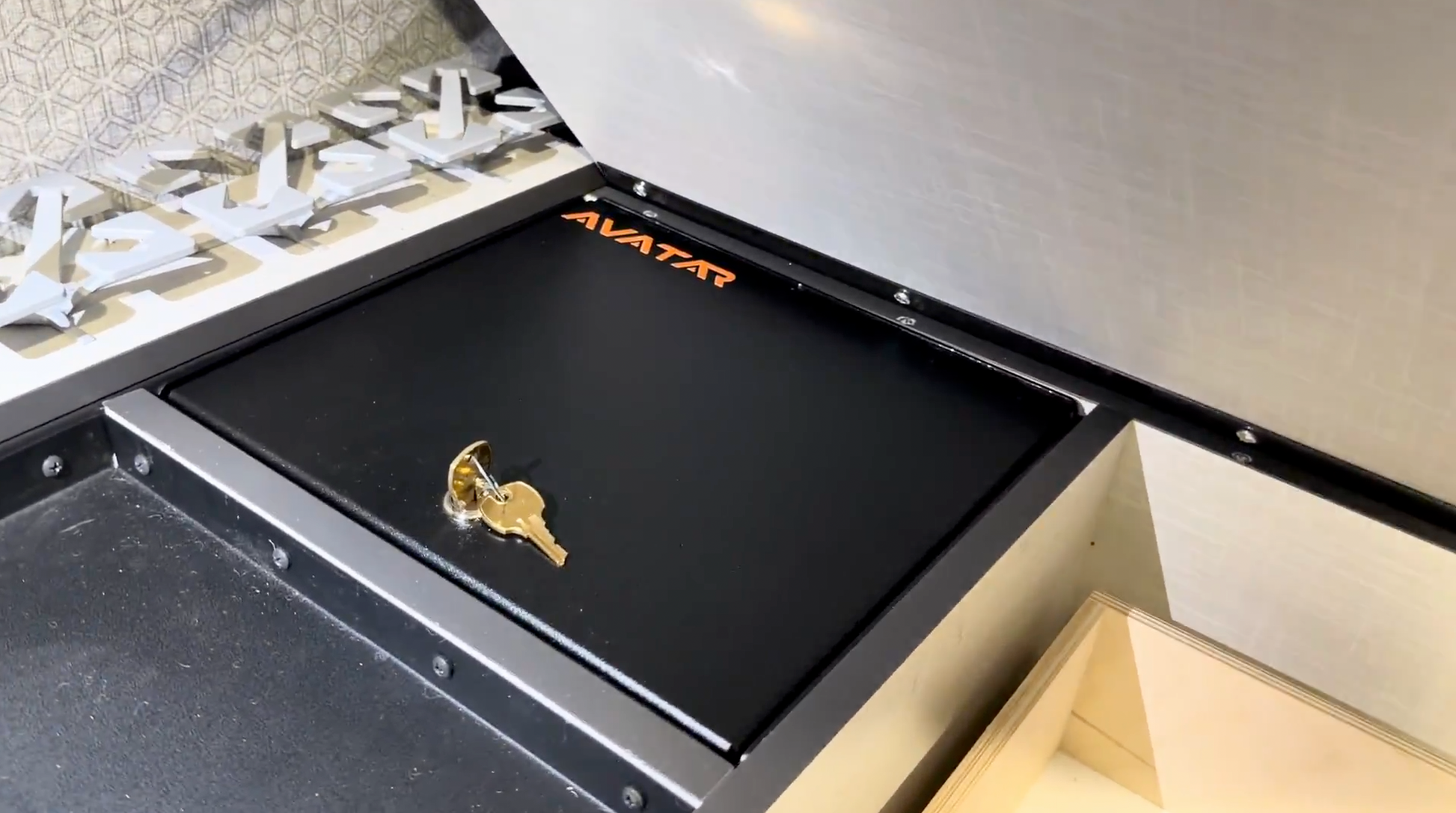 Avatar Ekko under-bed locking storage box in black metal with a gold key on Tampa Home & Garden Store