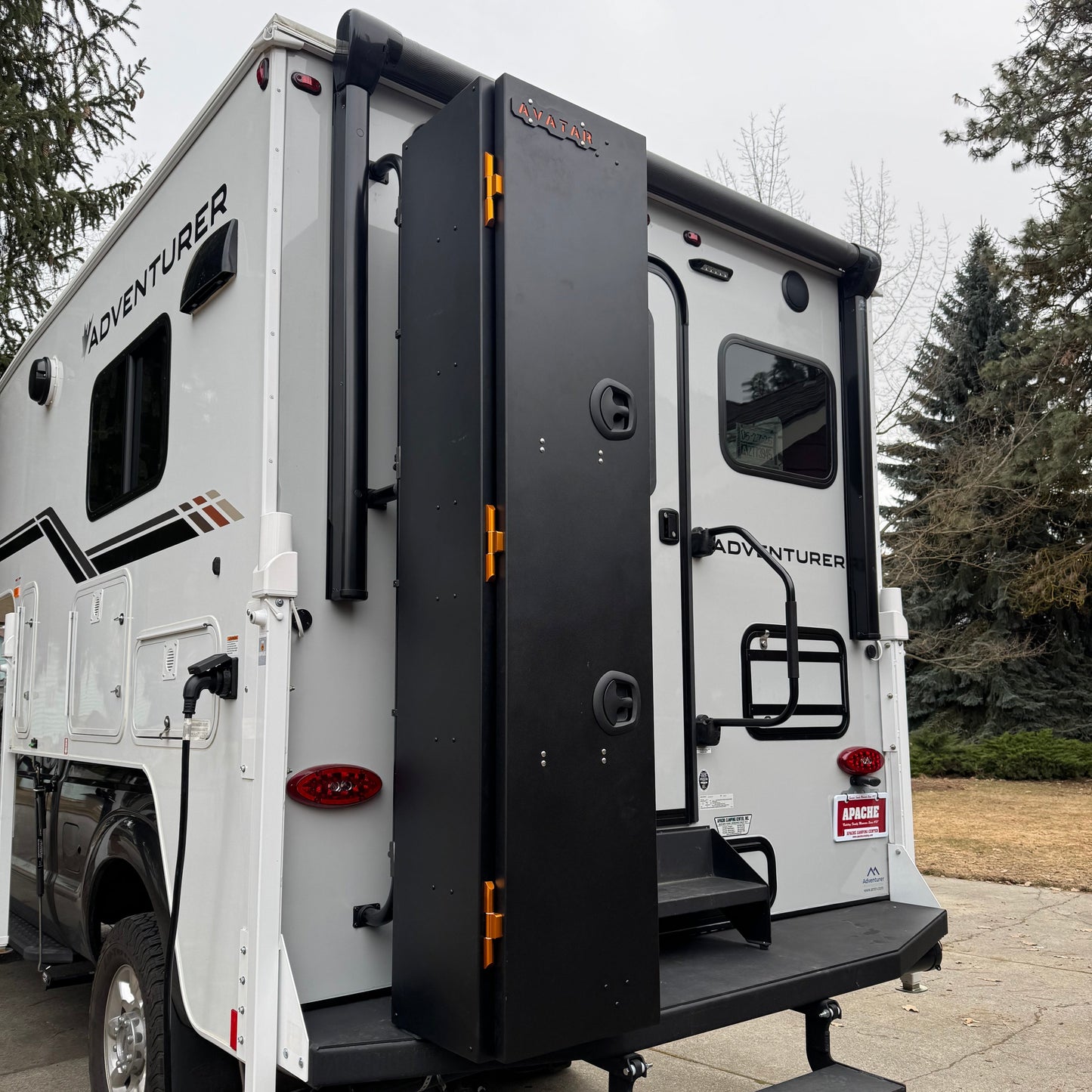 Avatar Ski 4 Storage Box, black with orange hardware, mounted on back of RV on Tampa Home & Garden Store