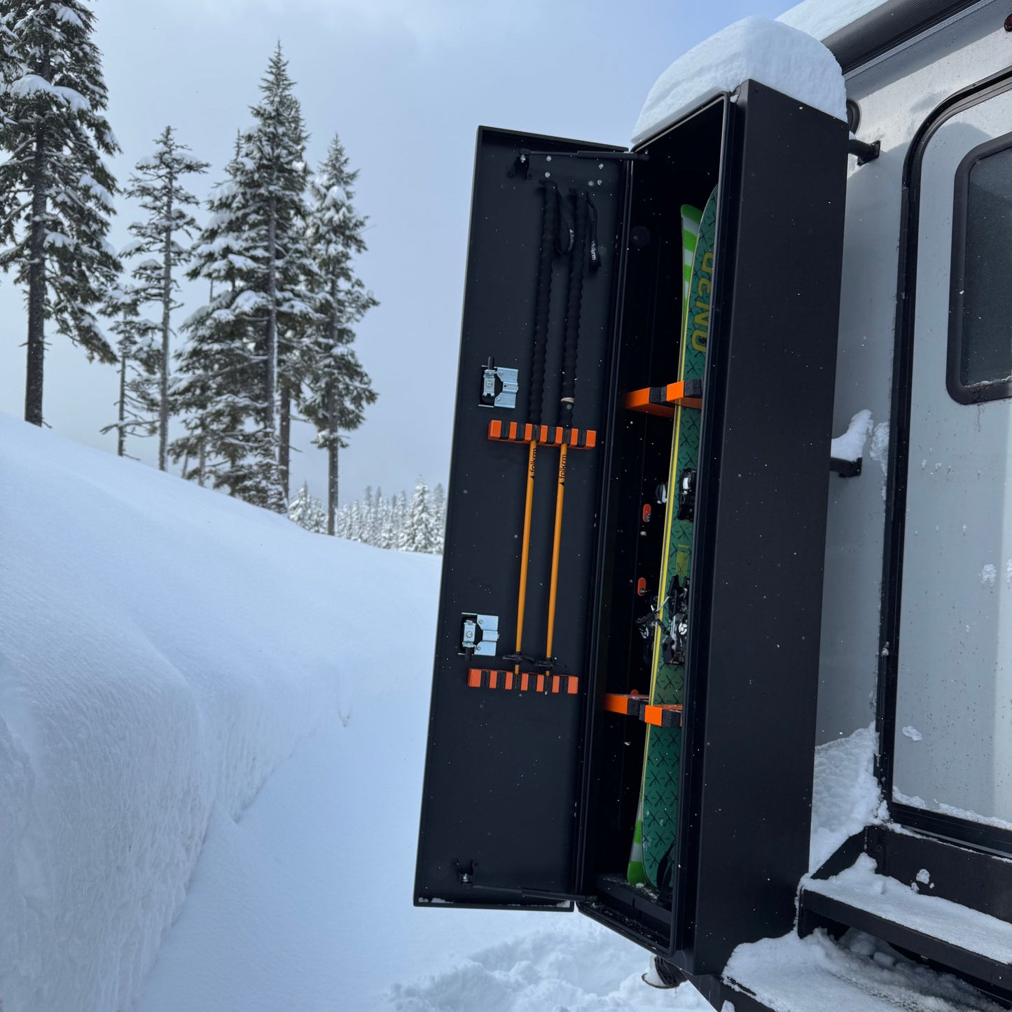 Avatar Ski 4 Storage Box mounted on a snow rack with skis inside, black with orange hooks on Tampa Home & Garden Store