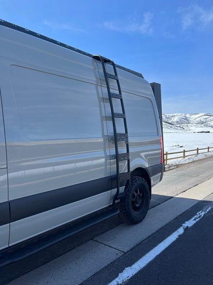 The Ultra Rack by avatar offroad low-profile roof rack on a Sprinter van with a black side ladder on Tampa Home & Garden Store