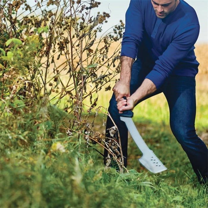 Fiskars 29in machete axe with white blade in use chopping brush outdoors on Tampa Home & Garden Store