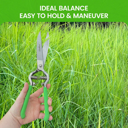 Garden Guru pruners with bright green handles and metal blades in tall grass on Tampa Home & Garden Store