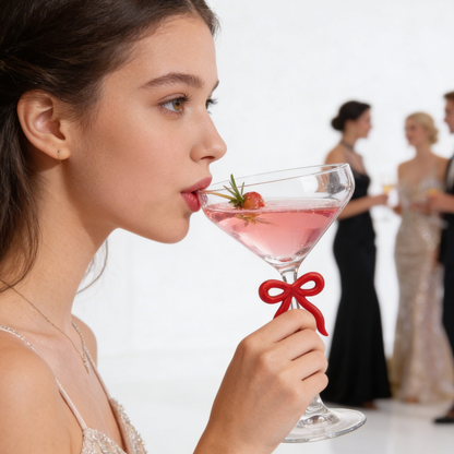Single Clear Martini Glass With A Red Bow Stem
