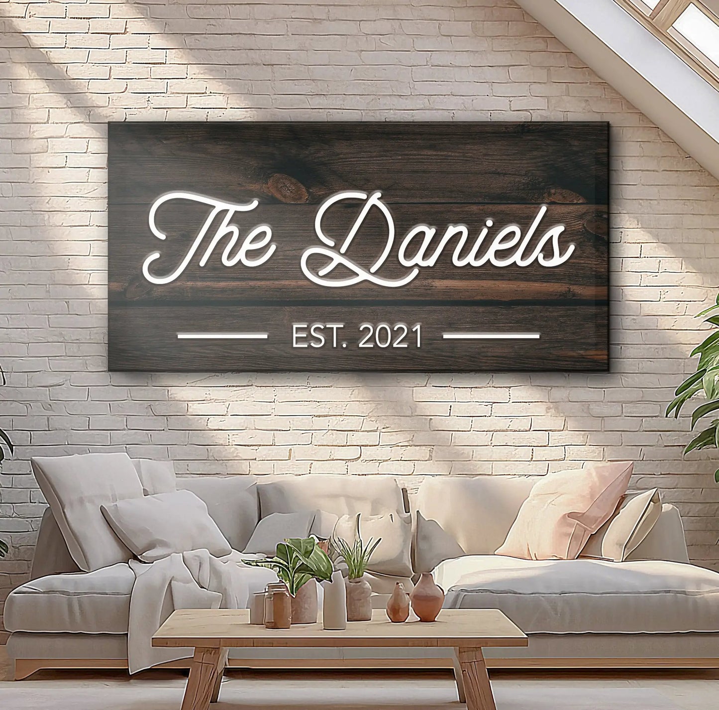 Wooden family name sign with neon white script The Daniels on a dark wood panel on Tampa Home & Garden Store