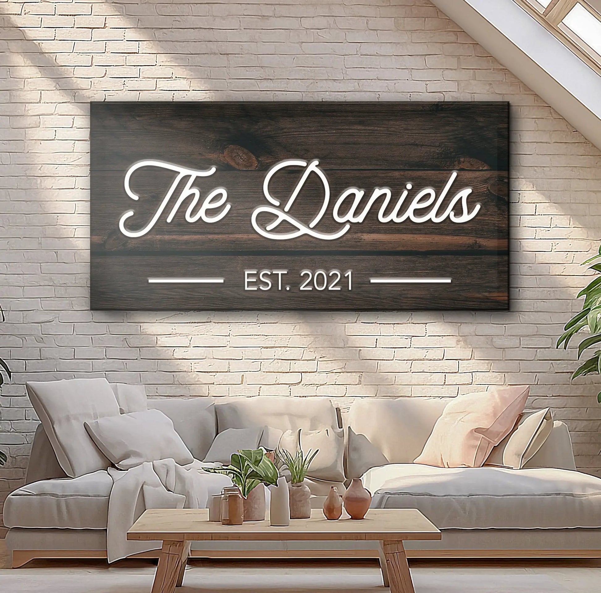Wooden family name sign with neon white script The Daniels on a dark wood panel on Tampa Home & Garden Store