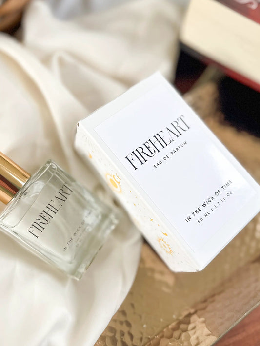 Fireheart perfume bottle and box labeled In the Wick of Time reveal radiant amber scent on Tampa Home & Garden Store