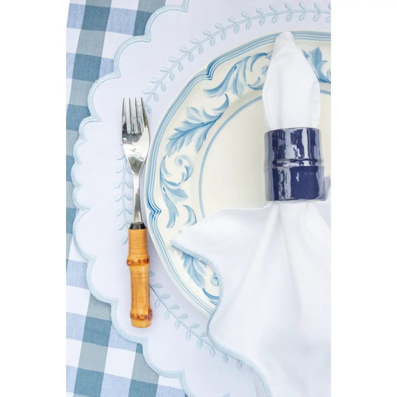 Brazilian bamboo napkin ring for table settings around a white napkin on a blue-toned plate on Tampa Home & Garden Store