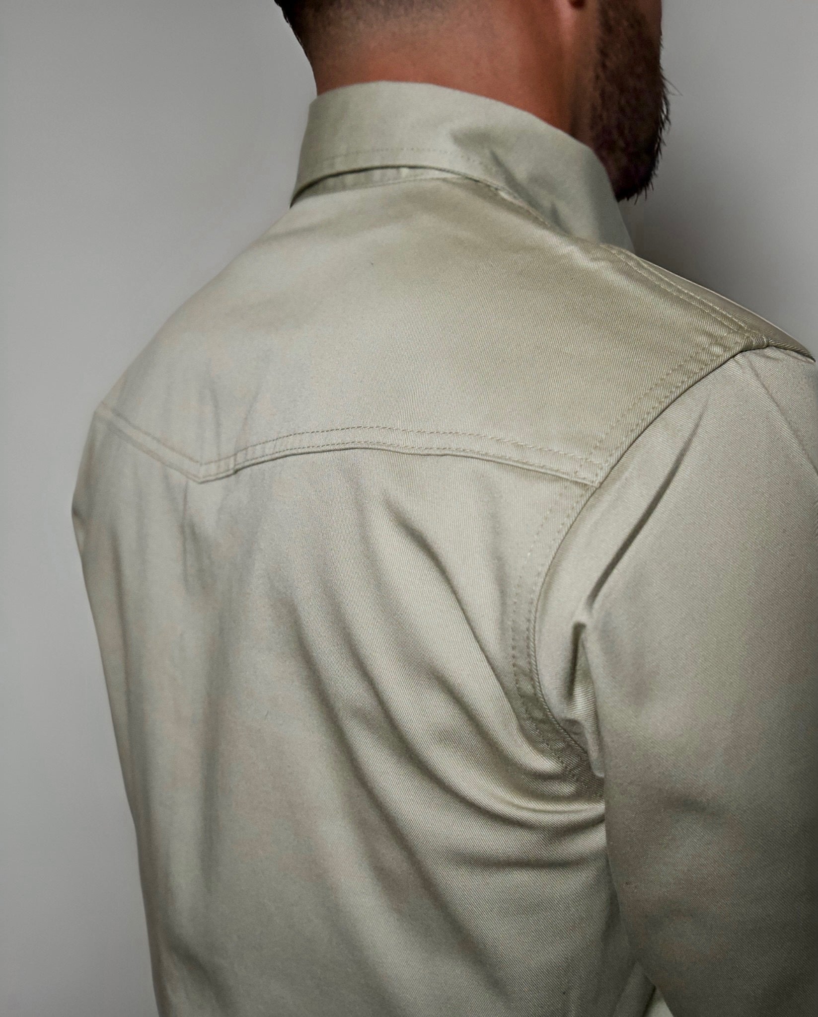 Static FR Western Style Pearl Snap khaki shirt back view with shoulder seam on Tampa Home & Garden Store