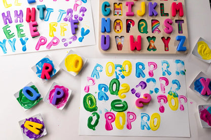 ABC Find & Fit Puzzle by Domino & Juliette, colorful plastic alphabet letters on a wooden board on Tampa Home & Garden Store