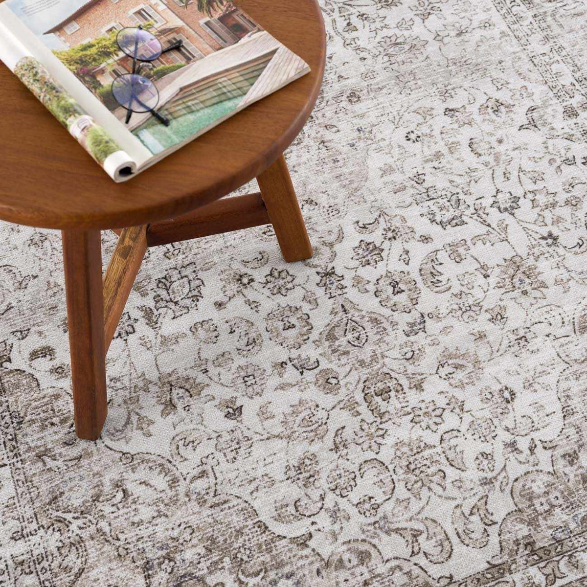 Pearl Holi-4601 washable area rug with beige floral pattern under a round table on Tampa Home & Garden Store