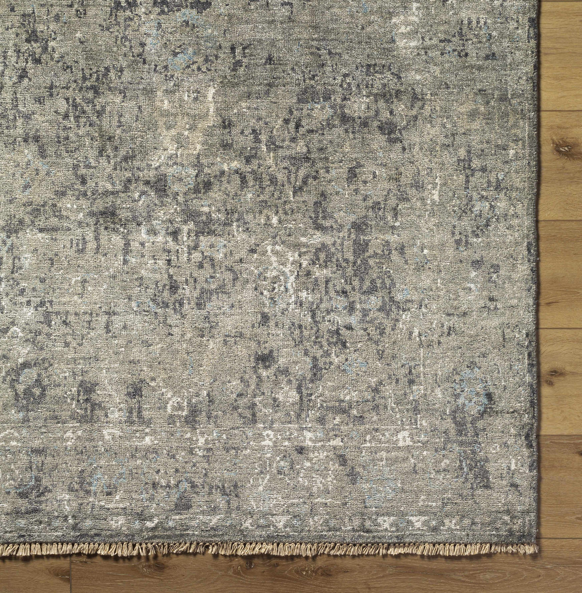Becerril Premium Rug from Boutique Rugs, distressed gray pattern with fringe edge on Tampa Home & Garden Store
